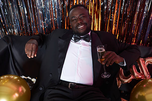 istock Enjoying Celebration in Elegant Formal Attire 2203533215