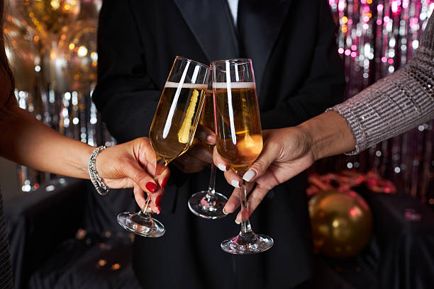 istock Clinking Champagne Glasses at New Year's Party Celebration 2203533251
