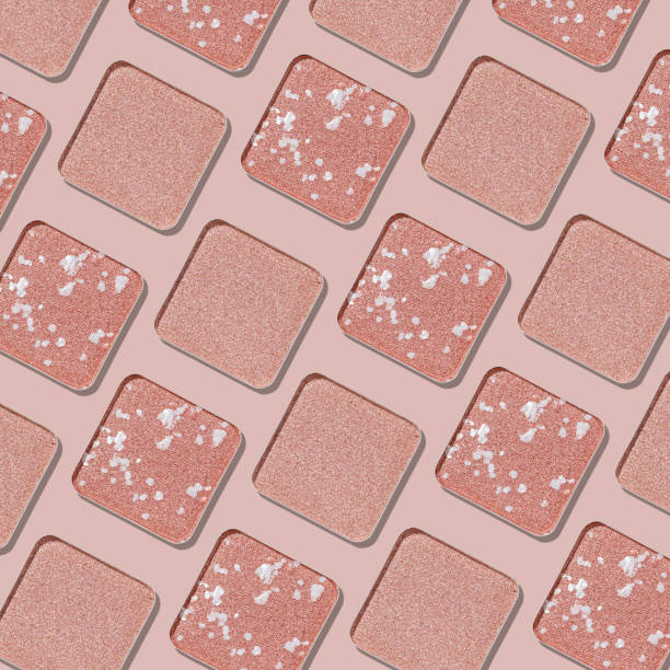 istock Swatches eyeshadow refills as minimal graphic pattern. Monochrome Matte, glitter pans pale pink shade, detailed texture, natural light, minimal cosmetics background, beauty product, eye makeup 2203534395