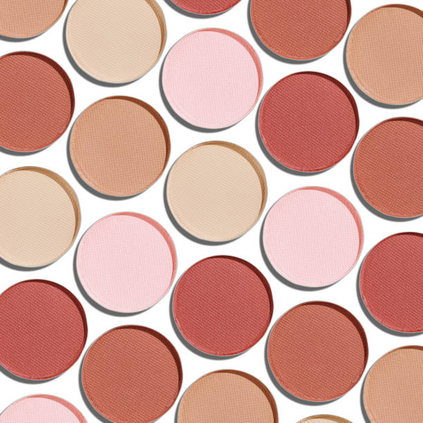 istock Swatches eyeshadow refills as minimal geometric pattern on white. Pastel matte pans brown beige nude shades with sun shadows, detailed texture, cosmetic, beauty concept makeup, top view layout 2203534396
