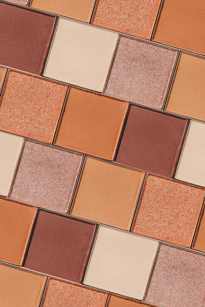 istock Cosmetics texture pattern, makeup palette vivid neutral color eye shadow, square eye powder swatches. Female cosmetic and beauty products, aesthetic minimal beauty photo, colorful eyeshade, top view 2203534398