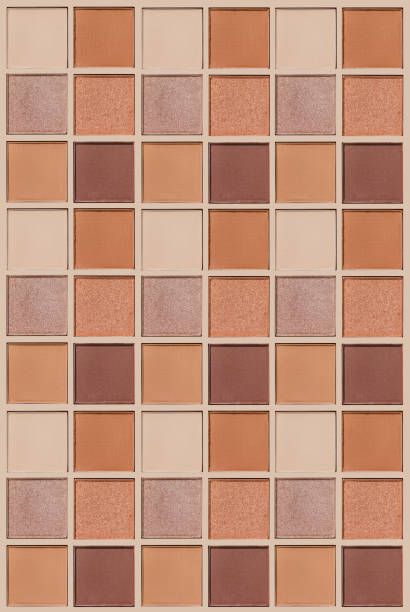 istock Cosmetics texture pattern, makeup palette vivid neutral color eye shadow, square eye powder swatches. Female cosmetic and beauty products, aesthetic minimal beauty photo, colorful eyeshade, top view 2203534406