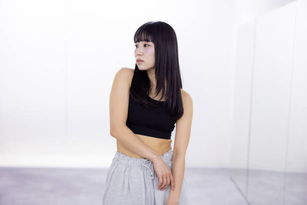 Portrait of female dancer standing in dance studio