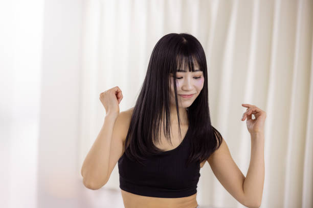 Female athlete dancing in dance studio - eyes closed