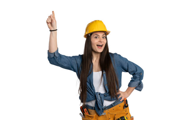 istock Excited construction worker woman with yellow hard hat and idea 2203540762