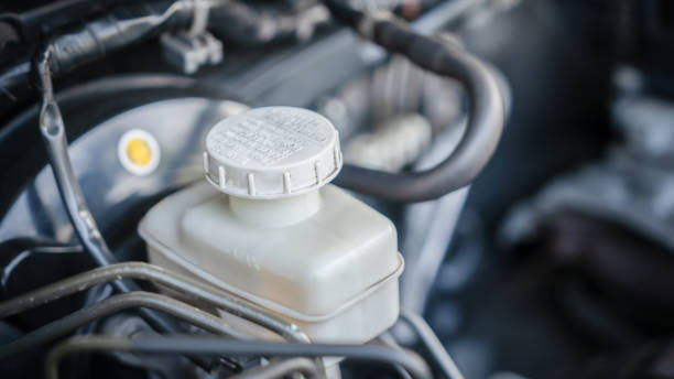 istock Car engine with white cover on top The cap says Brake Fluid. 2203541545
