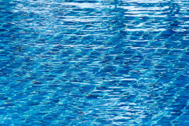 istock blue surface water of swimming pool in summer 2203541704