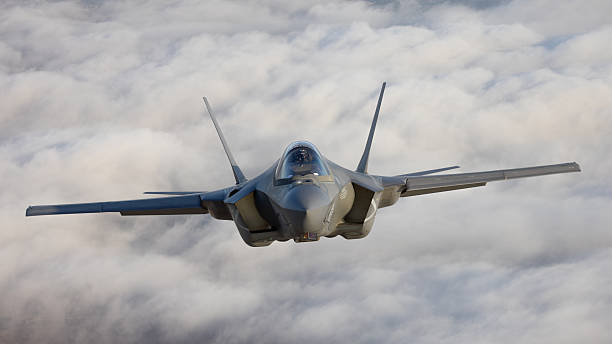 istock Very  close frontal view of a F-35C Lightning II   over clouds 2203542667