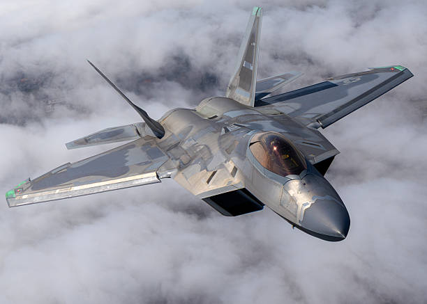 istock Extremely close view of a a F-22 Raptor  flying over clouds 2203542803