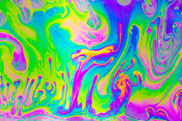 istock Psychedelic multicolored background abstract. Rainbow colors. patterns background. Photo macro shot of soap bubbles 2203544114