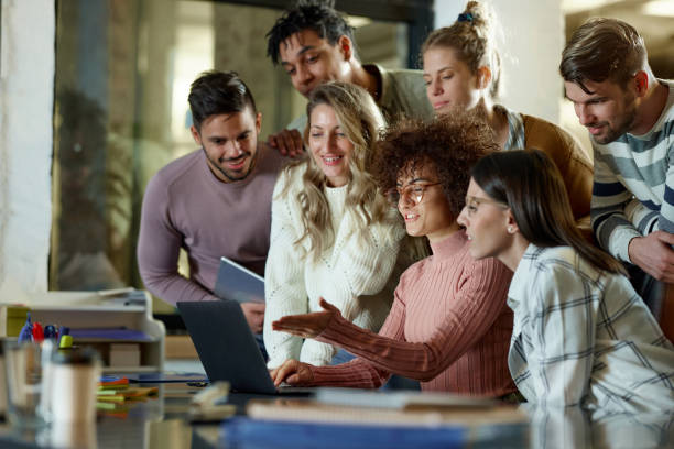 istock Team of happy creative people working on laptop in the office. 2203550941