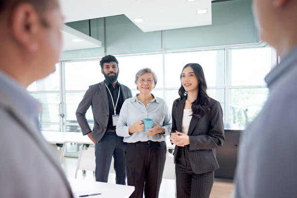istock Diverse business team engaged in a collaborative meeting in a bright modern office setting 2203551852