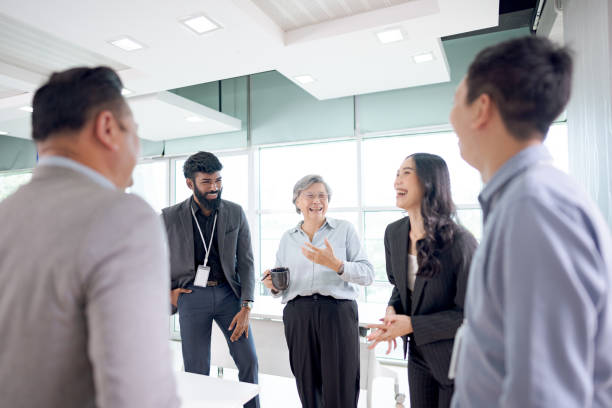 istock Diverse business team engaged in a collaborative meeting in a bright modern office setting 2203552129