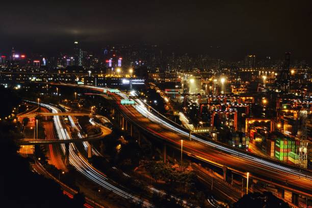 istock Urban highway and cityscape at night 2203553639