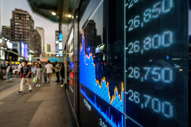 istock Illuminated Stock Exchange Data Display in a City Street Scene 2203556811