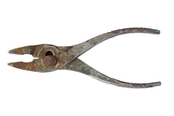 The old iron pliers are isolated. Rusty work tools.