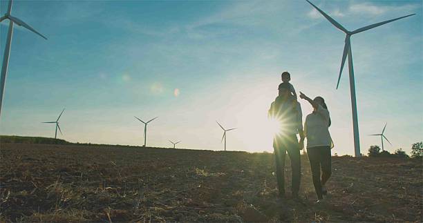 istock Family Exploring Wind Farm for a Sustainable Future. 2203557981