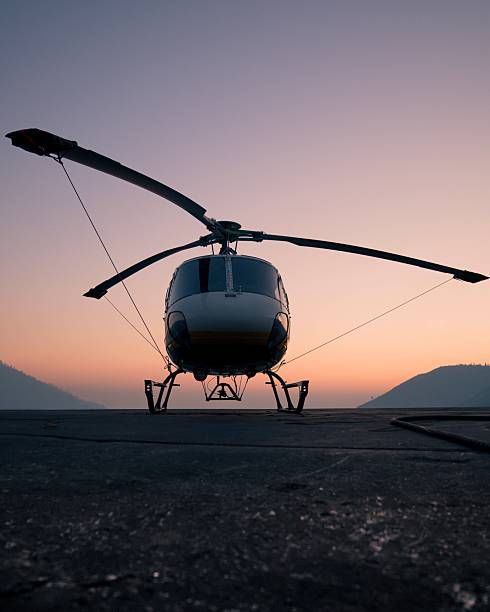 istock Front view of a helicopter at sunset with mountains in the background 2203558563