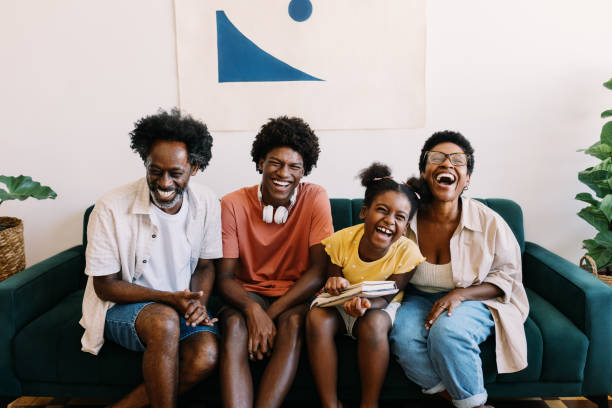 istock Parents and their kids share joyful laughter at home 2203558771
