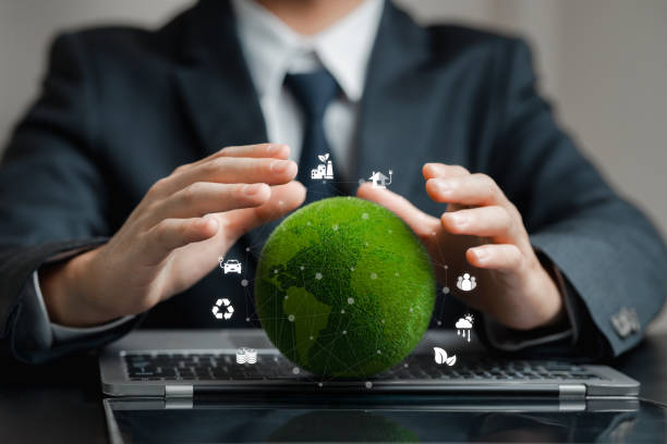 istock Businessman Protecting Eco-Friendly Globe With Sustainable Icons 2203565153