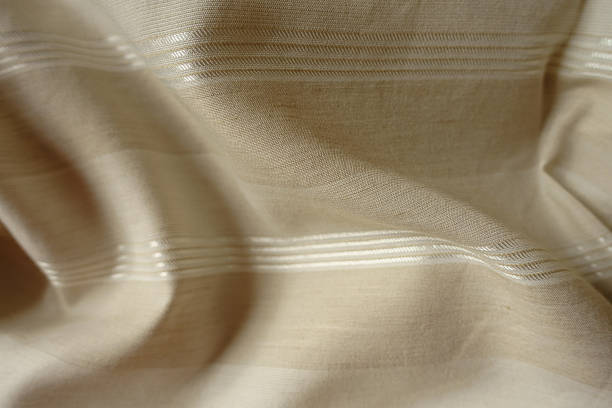 istock Rippled light beige striped cotton and polyester fabric 2203566026