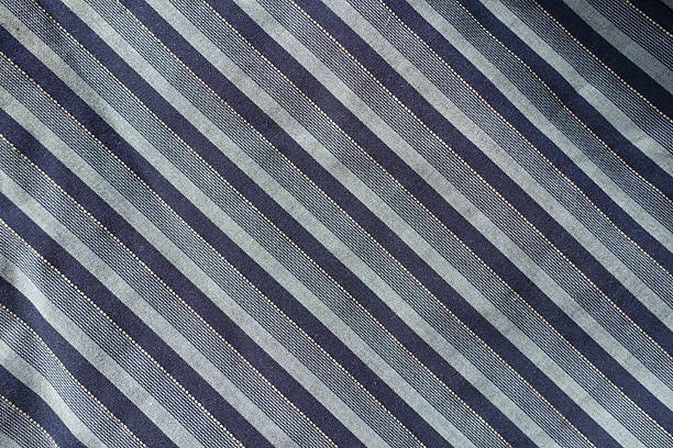 Texture of navy blue and grey striped cotton fabric