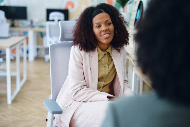 istock Young manager talking with a colleague in a modern coworking office 2203570018