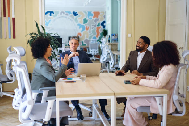 istock Business team discussing during a meeting in a modern office 2203570064