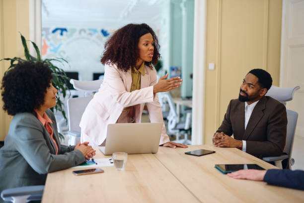 istock Business team discussing during a meeting in modern office 2203570164