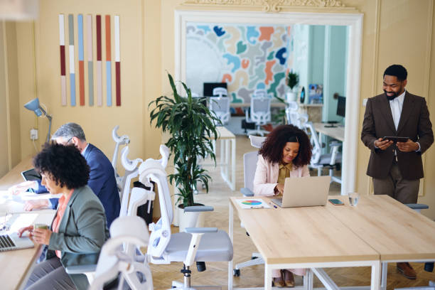 istock Diverse businesspeople working in a modern coworking space 2203570280
