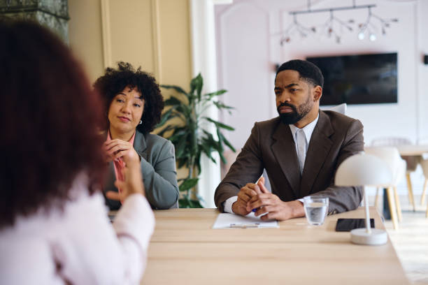 istock Managers interviewing a candidate for a job position in a modern office 2203570441