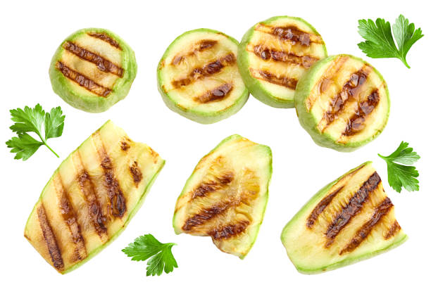 istock grilled sliced zucchini isolated on white background. clipping path 2203571618