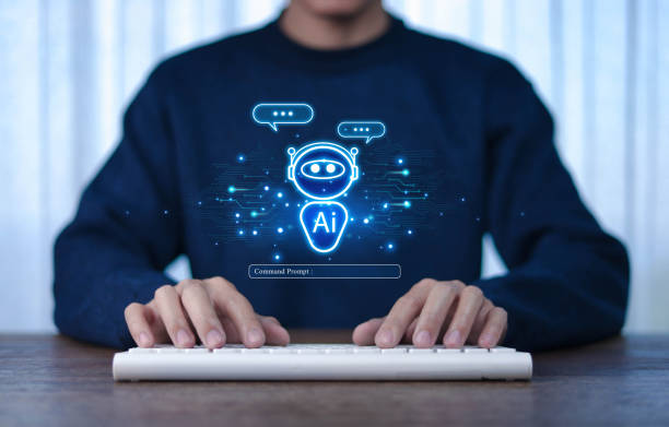 istock Businessman using AI robot technology. A man uses a laptop to talk to AI artificial intelligence. Future technology. 2203578484
