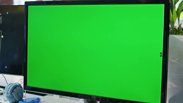 istock Green screen computer standing table at office room closeup. Worker hands typing 2203579842