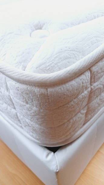 istock Bed corner detail with white border. Soft, Mattress. 2203581082