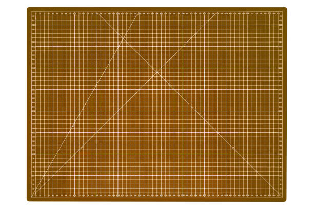 istock A big orange cutting mat with a white grid is isolated. 2203581403