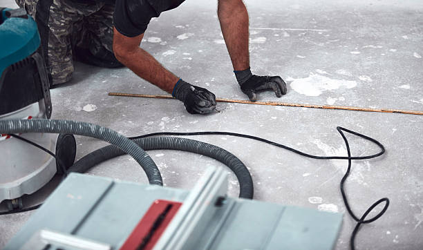 istock Professional handyman installing laminate flooring in a new apartment. 2203584396