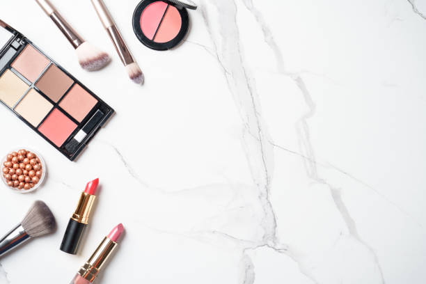 istock Make up products at white marble background. 2203587411
