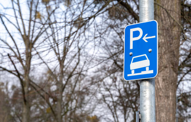 Blue parking sign for visitors.