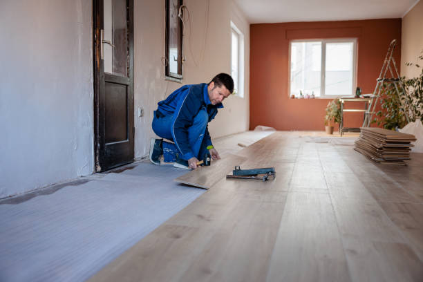 istock Skilled Man Installing laminate Flooring in Modern Home 2203589117