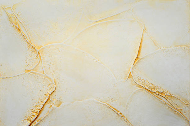 Decorative Venetian plaster with a texture of a plastic sandy surface with gold