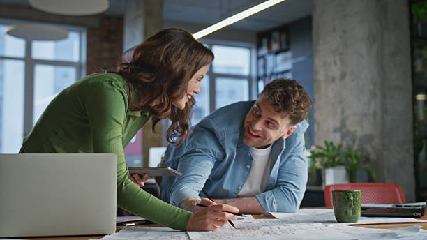 istock Professional architects working blueprint agency. Specialists creating project 2203592948