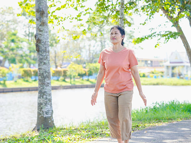 istock Elderly woman walking, running 2203595364
