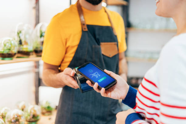 istock Contactless payment in flower shop 2203597368