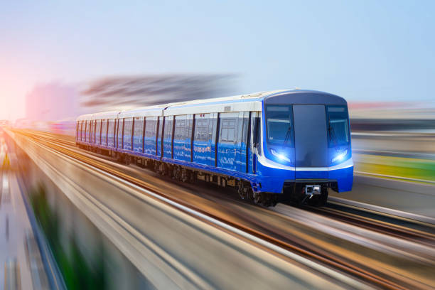 istock Subway train passes motion blur speed in a bridge at a passenger station 2203598772