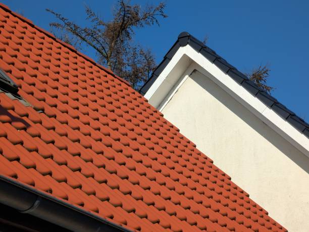 istock Red Tiled Roof Meets Modern Black Roof with White Facade 2203603627