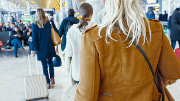 istock Mid-Age Caucasian Women Navigating Airport Terminal 2203605683