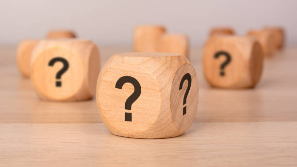 istock wooden cubes with question marks symbolizing uncertainty, decision-making, and curiosity 2203607900