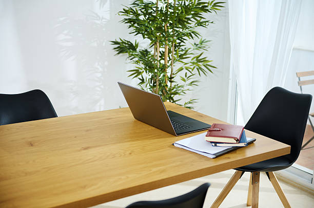 istock Modern Home Office With Laptop and Natural Light Interior Design 2203610508