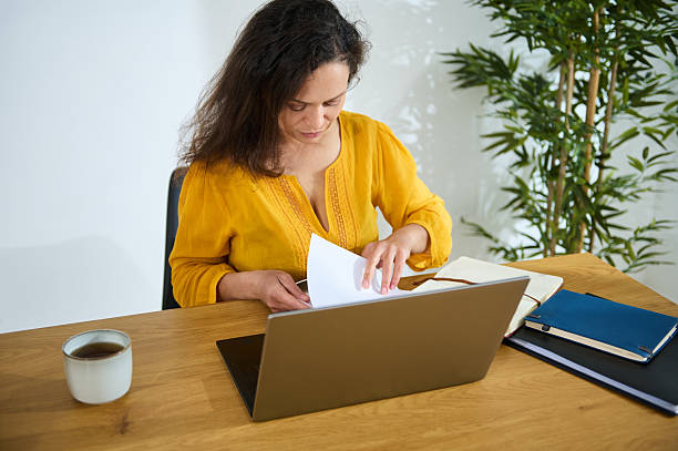 istock Confident Businesswoman Working Remotely in a Cozy Home Office Environment 2203610531
